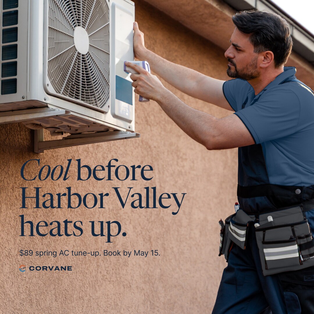 Concept brand: Corvane Heating & Air (fictional). A technician holds an infrared thermometer to an outdoor air conditioning unit mounted on a stucco wall. Text on the wall below the unit reads: Cool before Harbor Valley heats up. $89 spring AC tune-up. Book by May 15. Corvane logo below.